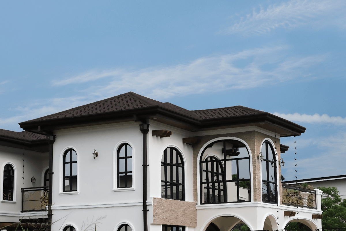Dark toned stone coated metal roofing on a house in the Philippines