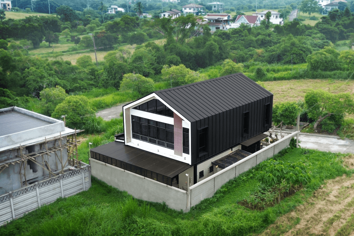 Black standing seam roofing on a house in the Philippines