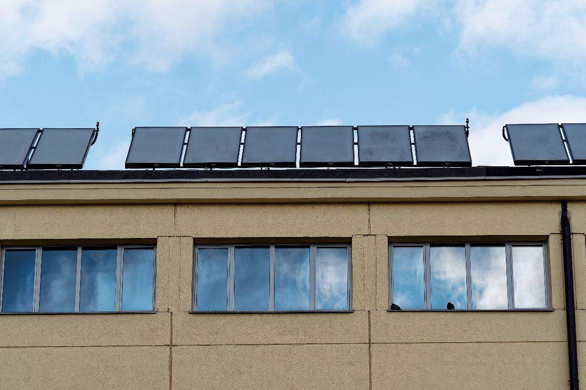 Solar panels placed at the top of a commercial building