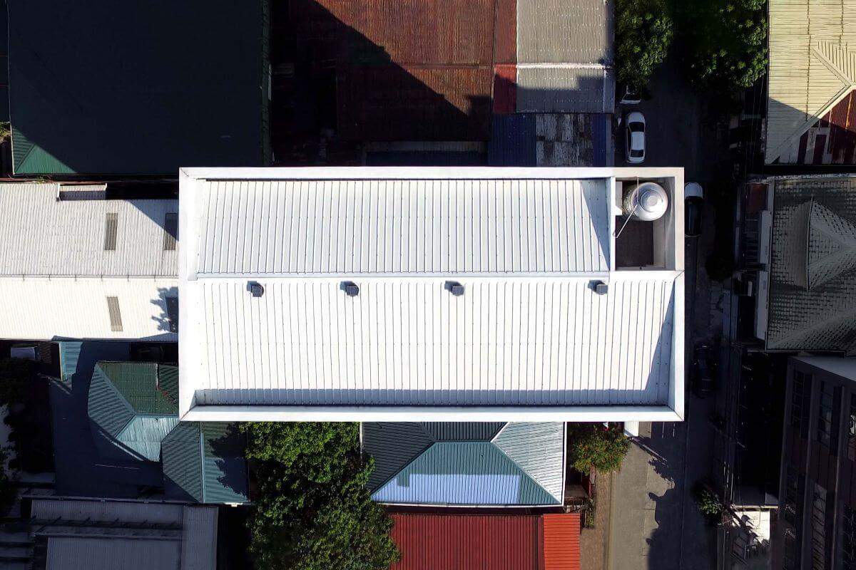 White roof installed on a building, providing clean aesthetics, durable protection, and enhanced energy efficiency for modern structures.