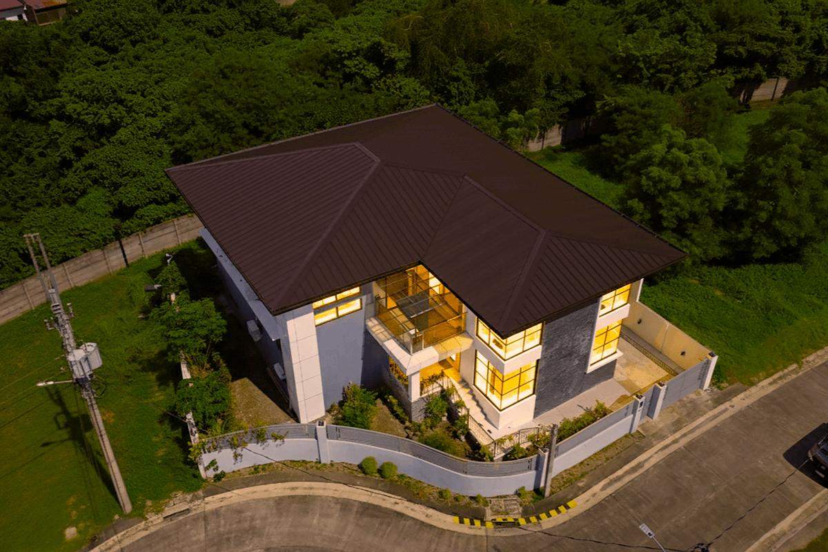 METL-0626C-FEAT-2 Aerial view of a modern home with durable metal roofing designed for typhoon-prone areas in the Philippines